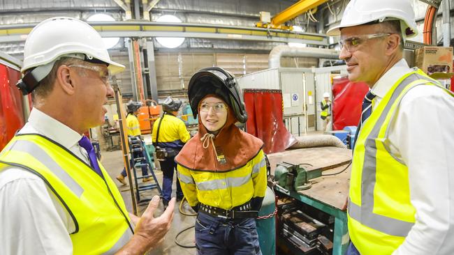 Defence Minister Richard Marles (L) and SA premier Peter Malinauskas speak to a welder, Trinity, at the Osborne Naval Shipyard. Picture: RoyV Photography