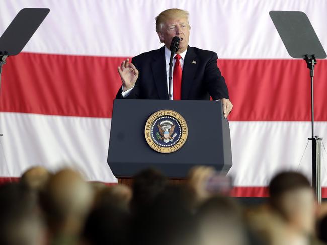 President Donald Trump addresses US military troops and their families in Italy on Saturday. Picture: AP