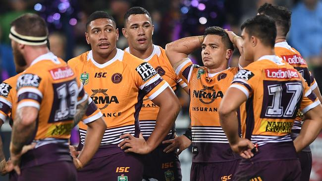 Broncos players reacts after a Storm try. Picture: AAP