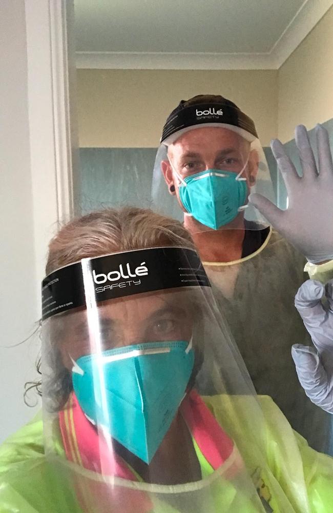 Grandma Ruth Symes' daughter-in-law Carol Willcox and grandson Tate Symes in PPE at Jeta Gardens to visit Mrs Symes before she died on February 2 after being diagnosed with Covid on January 26.