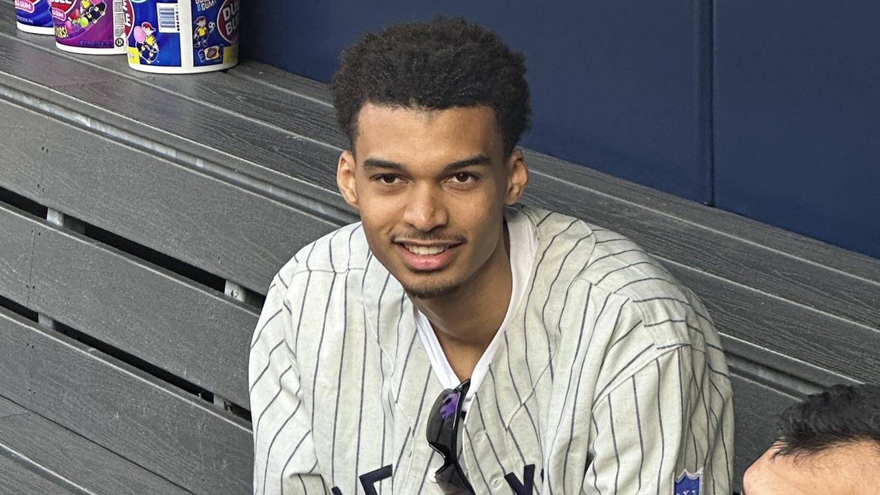 Picture of future NBA phenom holding a baseball is as ridiculous as it gets