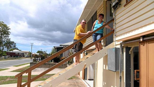 LONG TIME RESIDENTS: Ron and Audrey Christie indicate the height of the water during the 2013 floods in Hanbury Street North Bundaberg. Picture: Mike Knott BUN260319HAN4