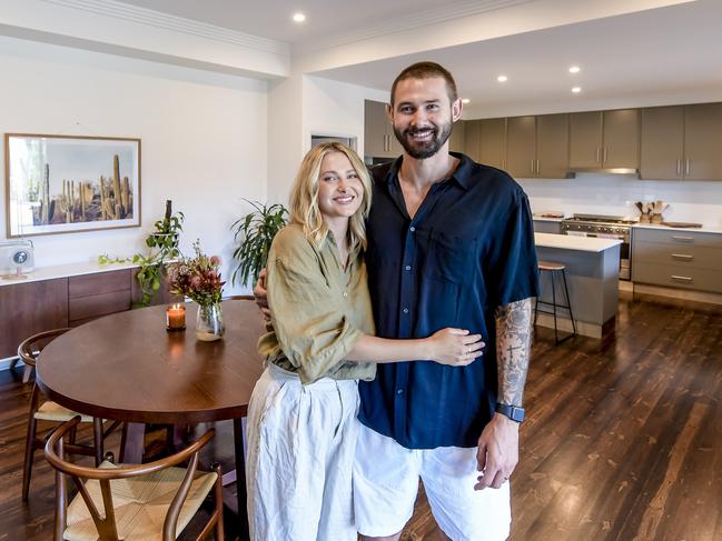 Cricketer Kane Richardson (R) with wife Nicole (L) at their Semaphore home which they are sellingWednesday 1 December  2021 Pic Roy VanDerVegt