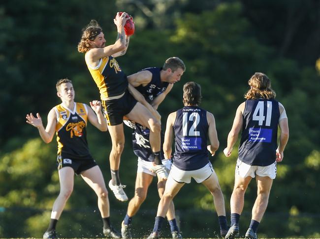 Frankston YCW’s BJ Credlin takes a mark against Rosebud. Picture: Valeriu Campan