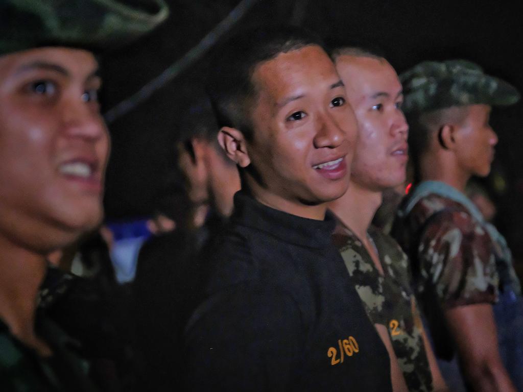 Military personnel, rescue workers and volunteers head out from Tham Luang Nang Non cave after ambulances transported a group of boys rescued from the cave. Picture: Getty