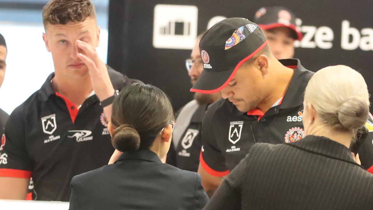 Latrell Mitchell and Jack Wighton check in at Sydney airport before a flight to New Zealand on Monday. Picture: John Grainger