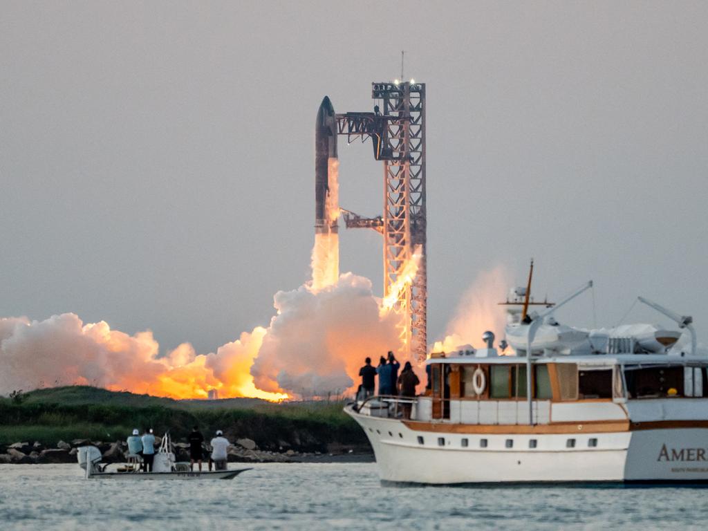 SpaceX successfully “caught” the first-stage booster of its Starship megarocket. Picture: AFP