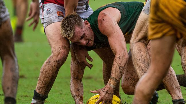 Saints’ Lucas Jellyman-Turner competes for the ball in the mud. Picture: Che Chorley