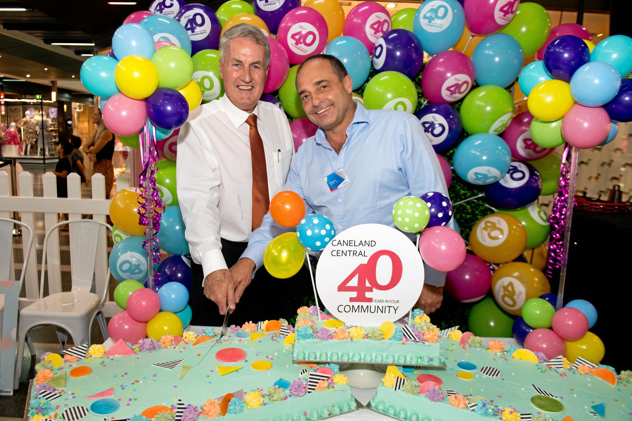 Mackay Regional Council mayor Greg Williamson and Gary Horwitz, managing director at Lendlease Retail, cut the cake at the Caneland Central 40th birthday celebrations. Picture: Emma Murray