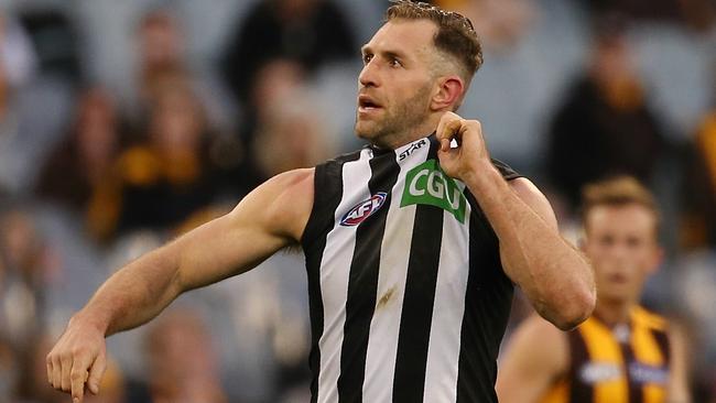 Travis Cloke tugs his Collingwood jumper after kicking a goal in the loss to Hawthorn. Picture: Wayne Ludbey