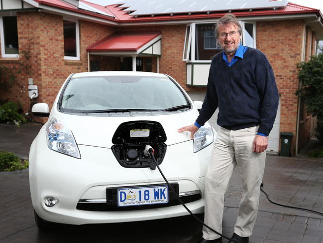 Clive Attwater of Bellerive with his Nissan Leaf electric car that is recharged using energy from the solar panels on his home. Picture: NIKKI DAVIS-JONES