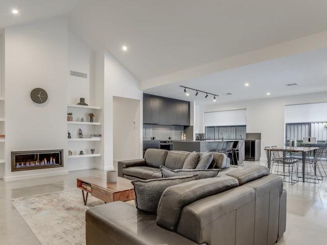 The home was constructed with polished concrete floors, recycled brick feature walls, recycled hardwood timber and elevated ceilings. Picture: realestate.com.au