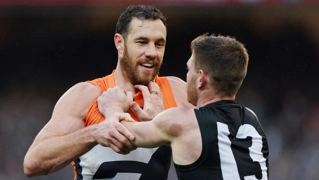 Shane Mumford wrestles with Collingwod’s Taylor Adams on Saturday. Picture: AAP