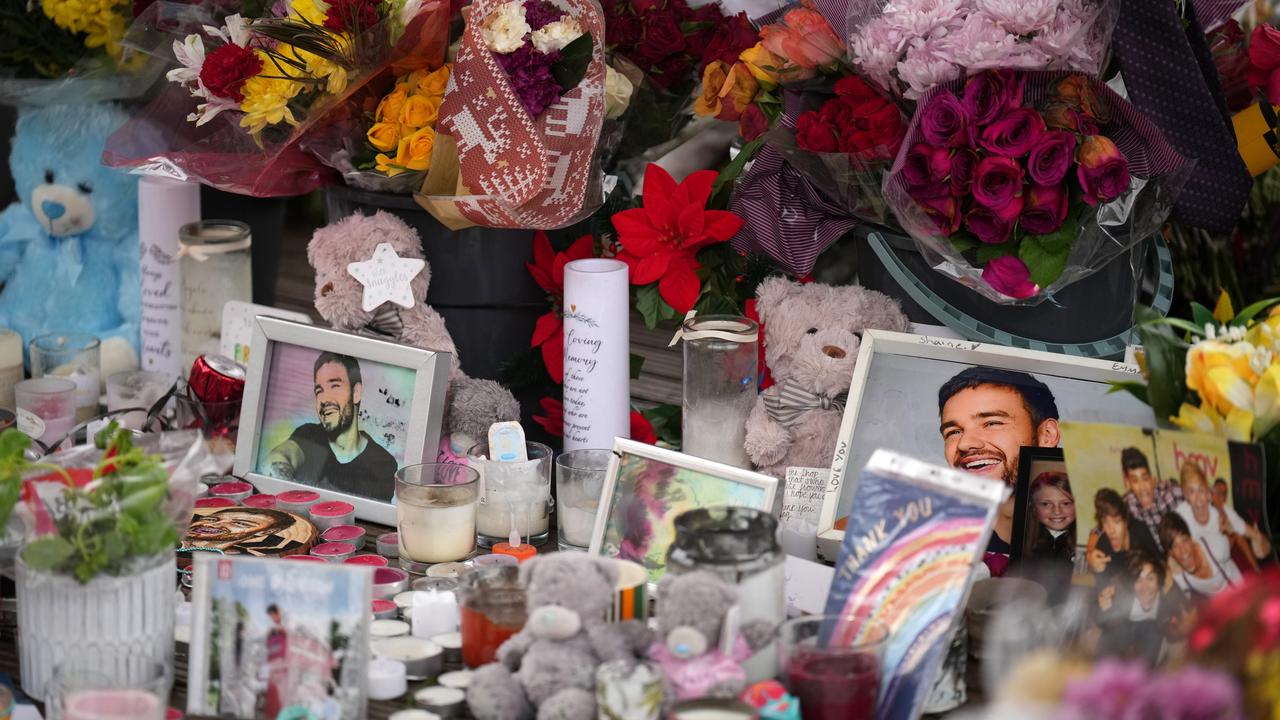 Flowers and tributes for One Direction's Liam Payne lay in the bandstand of West Park after being relocated from the town centre by council workers in Wolverhampton, England. Photo: Christopher Furlong/Getty Images.