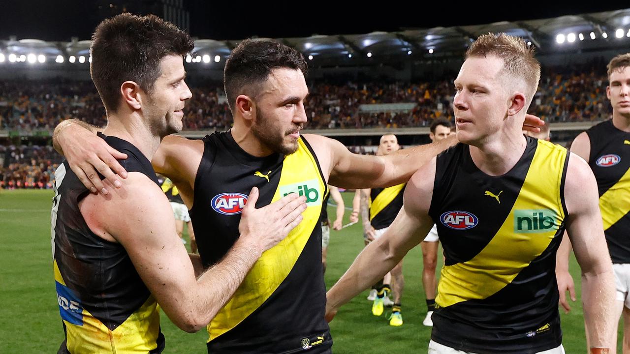 Shane Edwards of the Tigers is chaired from the field after his final match by teammates Trent Cotchin (left) and Jack Riewoldt (right) during the 2022 AFL Second Elimination Final match between the Brisbane Lions and the Richmond Tigers at The Gabba on September 1, 2022 in Brisbane, Australia. (Photo by Michael Willson/AFL Photos via Getty Images)
