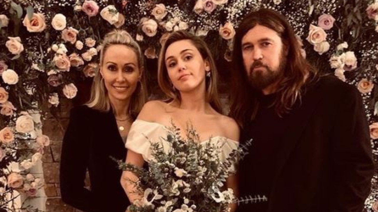 Miley with parents Tish and Billy Ray Cyrus.