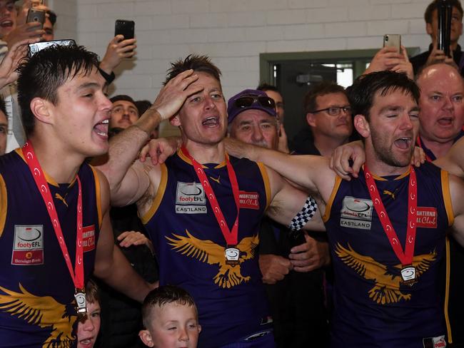 Ryan Mullett (centre) of Vermont is seen in the rooms after winning the EFL Premier division Grand Final, at Bayswater Oval, Melbourne, Saturday, September 21, 2019. Vermont VS Blackburn. (AAP Image/James Ross) NO ARCHIVING