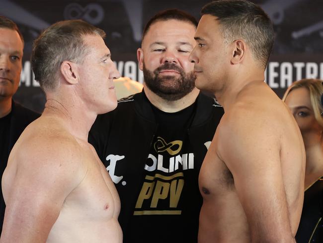 Paul Gallen and Justin Hodges face off at their weigh in at the Aware Super Theatre in Sydney. Picture: Mark Evans/Getty Images