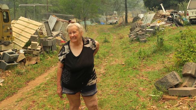 Camille Ross, 70, plans the stay and defend her Upper Mangrove property in Dubbo Gully between the Wrights Creek and Three Mile fires. Picture: Richard Noone