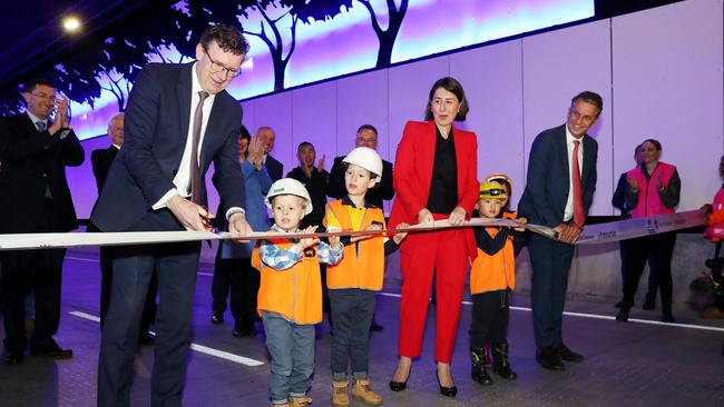 Federal Population, Cities and Urban Infrastructure Minister Alan Tudge, Premier Gladys Berejiklian and Transport and Roads Minister Andrew Constance officially open the tunnel with kids Malachi and Ezekiel Solomons. Picture: Tim Hunter