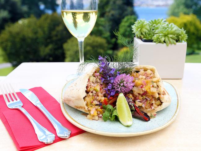 Succulent restaurant executive chef Johann Frais is pictured with Slow cooked pulled pork with fresh Tasmanian apple salsa in a pita bread pocket - $17.50