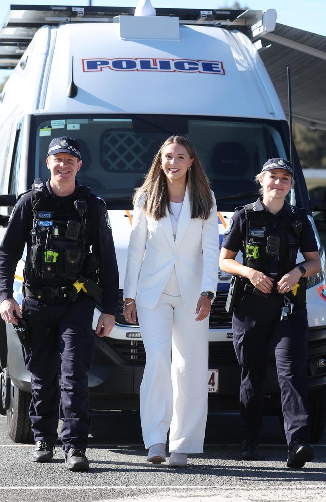 Housing Minister Meaghan Scanlon with Senior Constable Mark Richards and Constable Leah Carpenter from Nerang Station in front of the new mobile police beat in Carrara. Picture: Annette Dew.