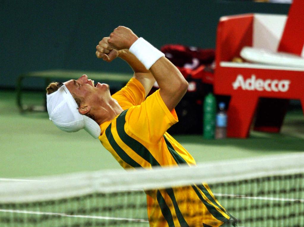 Lleyton Hewitt celebrates his Davis Cup victory over Roger Federer.