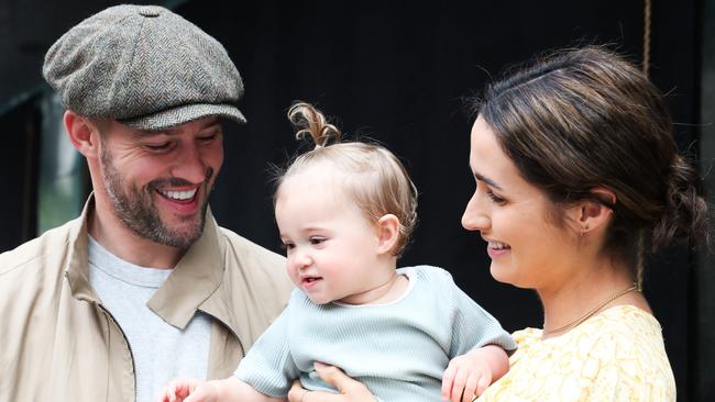 Kris Smith and partner Sarah Boulazeris with daughter Mila Elle at the opening of the Myer Christmas windows.