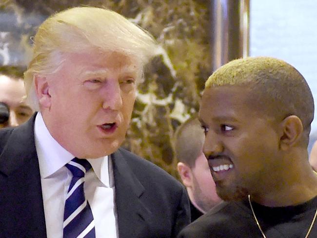 (FILES) In this file photo taken on December 13, 2016, singer Kanye West and President-elect Donald Trump arrive to speak with the press after their meetings at Trump Tower in New York. - The rapper and fashion designer Kanye West has suggested he will run for president and wants Donald Trump to be his running mate. Trump, for his part, brushed aside a recent meeting with West as of no significance. The artist, who goes by the name Ye, posted on November 24, 2022, a swirling symbol on his Twitter account with "Ye" and the number 24, apparently representing 2024, the year of the next US presidential election. (Photo by TIMOTHY A. CLARY / AFP)