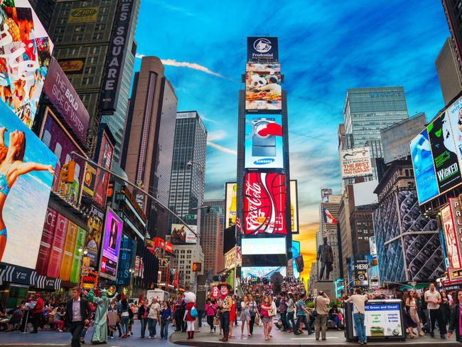 ESCAPE:  New York, USA - May 11, 2013: Times Square with tourists. Iconified as "The Crossroads of the World" it's the brightly illuminated hub of the Broadway Theater District.  Picture: Istock