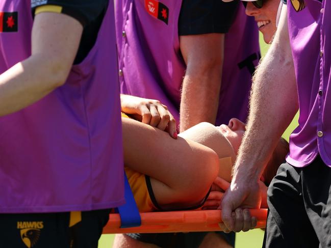 Mackenzie Eardley being assisted off the field. Picture: Getty Images