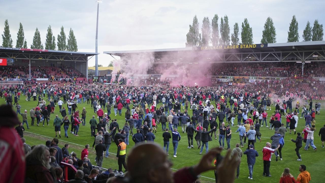 Wrexham fans were also happy with the win. Picture: AP Photo/Jon Super