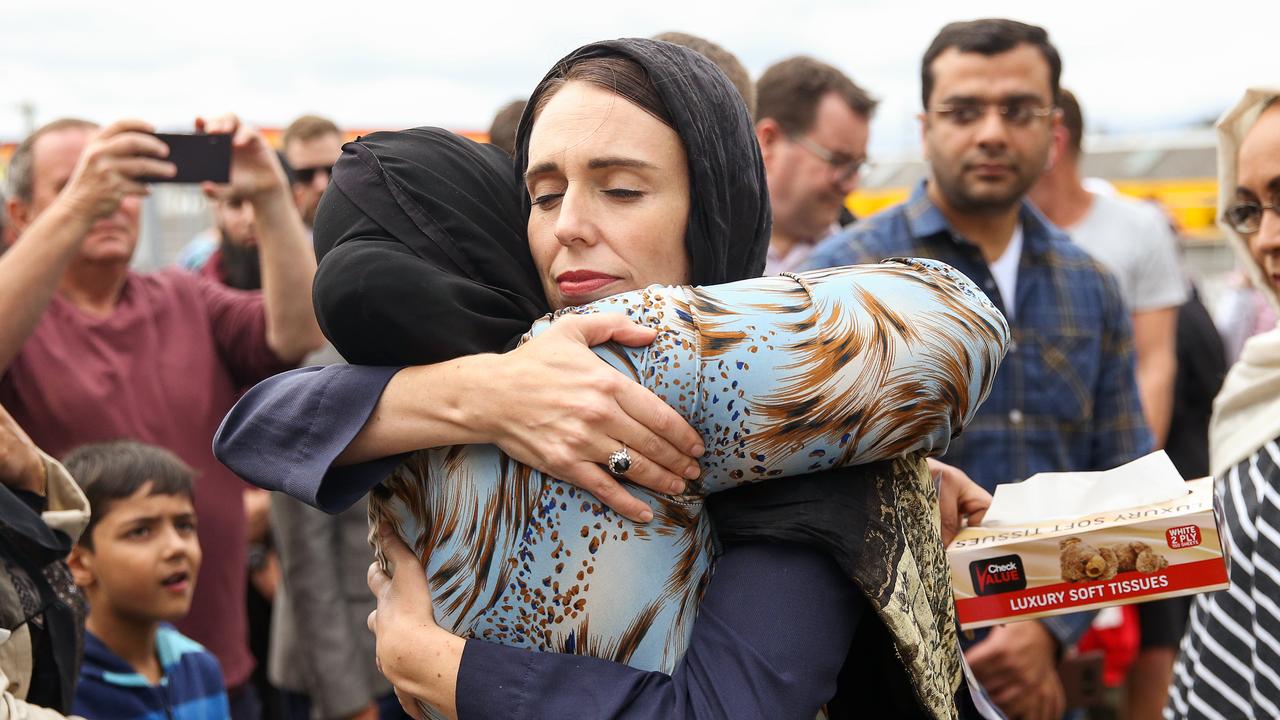 Prime Minister Jacinda Ardern embraces a woman at the Kilbirnie Mosque, Wellington two days after the massacre. Picture: Hagen Hopkins/Getty