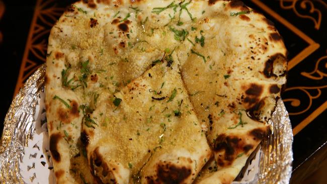 Mop up your curries with some garlic naan bread.