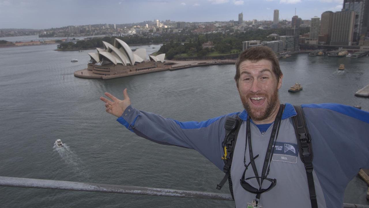 Nick Hayes at work up on the Sydney Harbour Bridge. Picture: BridgeClimb Sydney