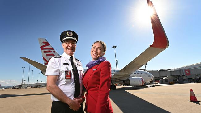 Virgin Australia captain Scott Gwynne and cabin crew Svetlana Watson prepare for take-off at Brisbane Airport,on Wednesday. Picture: Lyndon Mechielsen