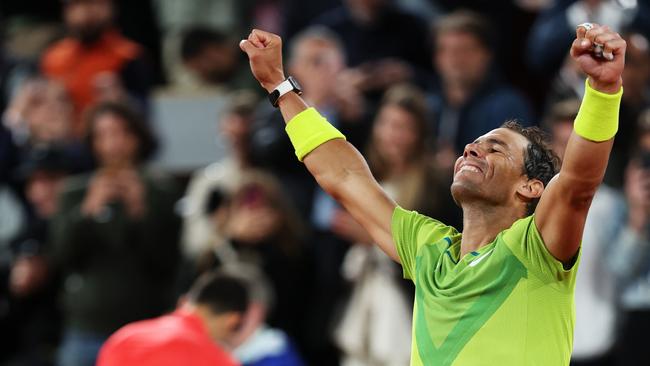 Rafael Nadal celebrates defeating Novak Djokovic in the 2022 French Open final.