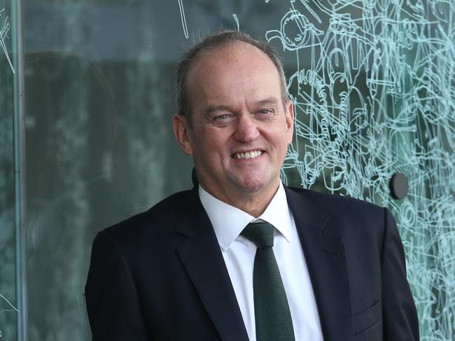 07/02/2019. Adrian Collette, newly appointed chief executive of the Australia Council for the Arts. Photographed at their offices in Surry Hills, Sydney. Artwork in background on window by Gosia Wlodarczak, Frost and shadow drawing for the Australia Council.  Britta Campion / The Australian