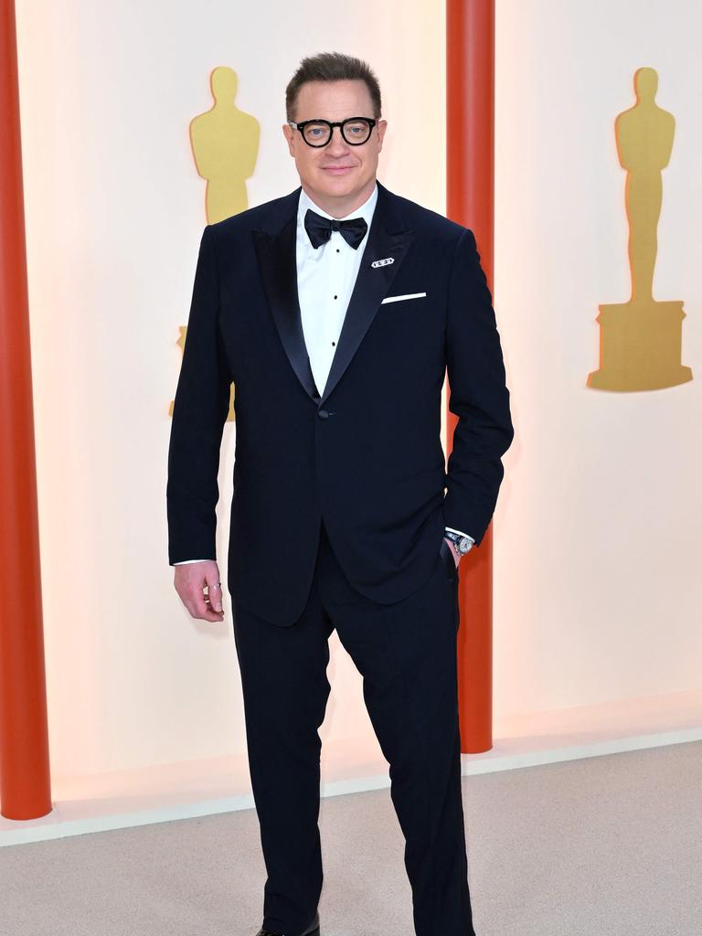 Best Actor winner Brendan Fraser wears Giorgio Armani. (Photo by ANGELA WEISS / AFP)