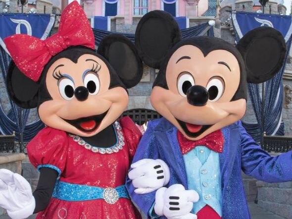 DISNEYLAND, ANAHEIM .. for Dan Strudwick story .. MICKEY AND MINNIE DAZZLE IN NEW COSTUMES FOR DIAMOND CELEBRATION (ANAHEIM, Calif.) Appearing at Sleeping Beauty Castle, Mickey Mouse and Minnie Mouse look dazzling in their sparkling, new costumes, created especially for the Diamond Celebration at the Disneyland Resort. Mickey and his friends will debut their new costumes when the Diamond Celebration begins on May 22, 2015. (Paul Hiffmeyer/Disneyland Resort) Picture: Disney