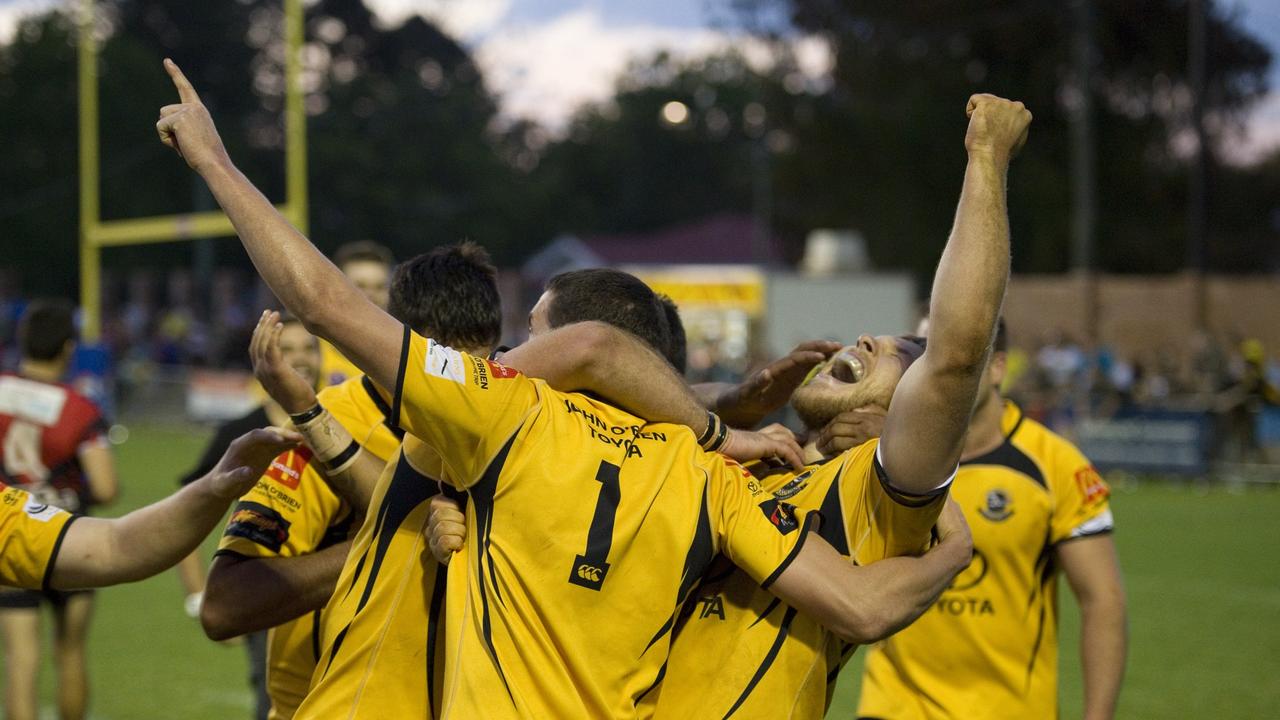 Gatton players including Aaron Werth (left) and Ben Reuter celebrate their win. Photo: Kevin Farmer