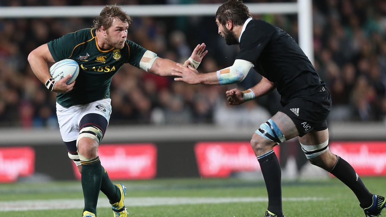 Duane Vermeulen of South Africa looks to fend off Sam Whitelock of the All Blacks.