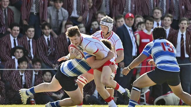 Ipswich Grammar winger Mitchell Harsant takes on the tackle of Nudgee prop Harry Vella as Dillon Stone and Eyzaiah Ulia watch on.