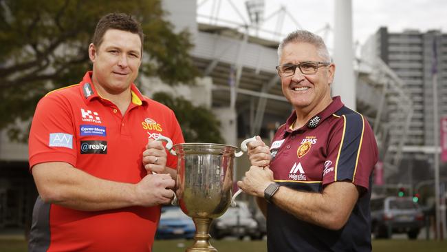 Stuart Dew and Chris Fagan with the QClash trophy. Picture: AAP