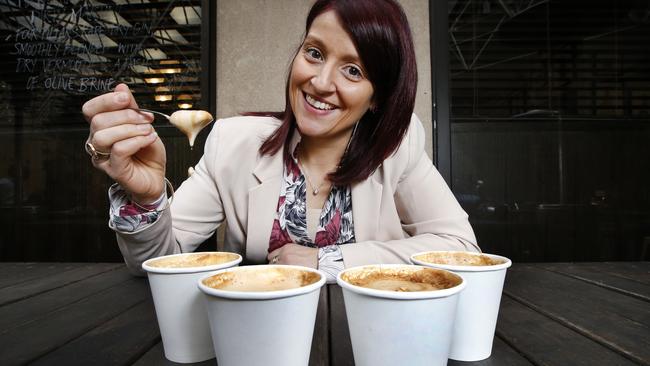 Coffee expert Melissa Caia checks the density of the froth during our Sunday Herald Sun taste test. Picture: David Caird