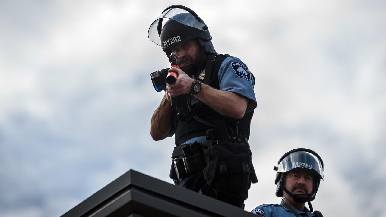 Officers on the roof of the police precinct. Picture: Kerem Yucel/AFP