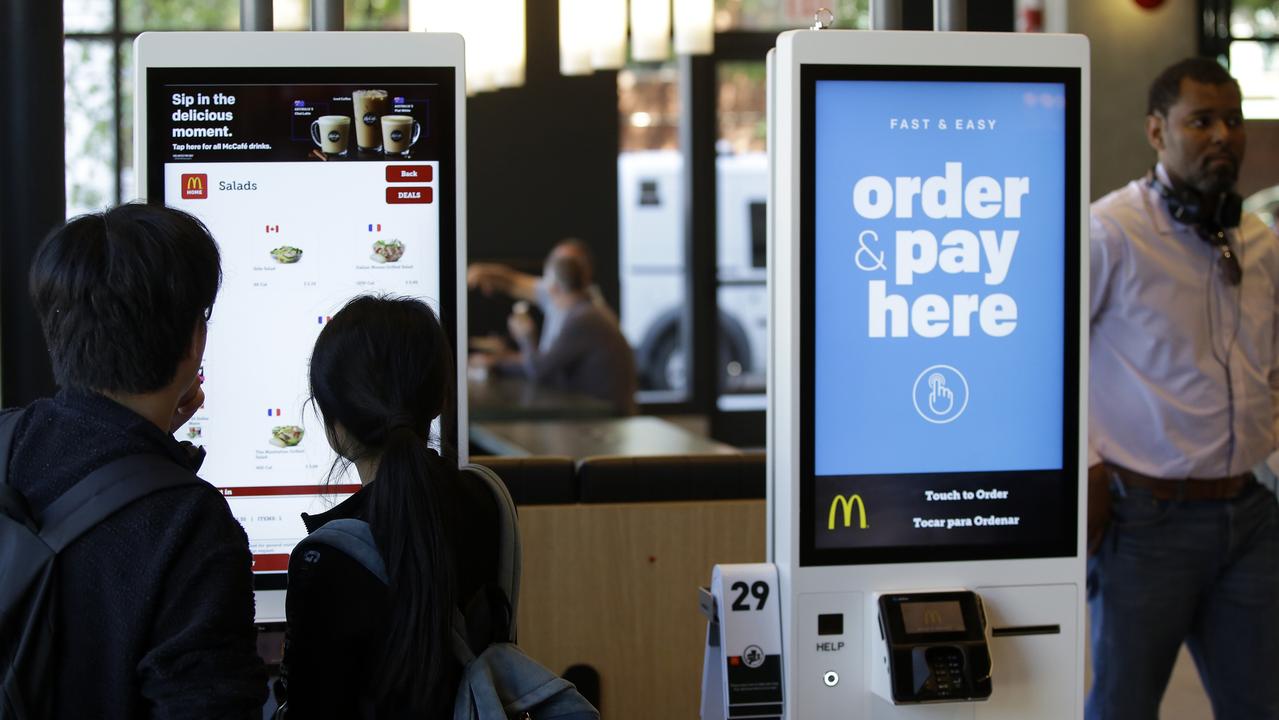 A McDonald’s spokeswoman said an “antimicrobial film with advisory stickers” had been added to each order kiosk. Picture: Joshua Lott/Bloomberg