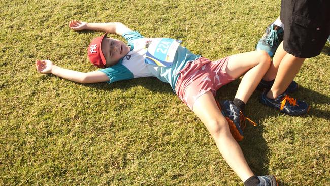 Angus Green, 7, enjoys the lush grass at Wests in Walkerston after completing the 5km Run for MI Life. October 17, 2021 Picture: Marty Strecker