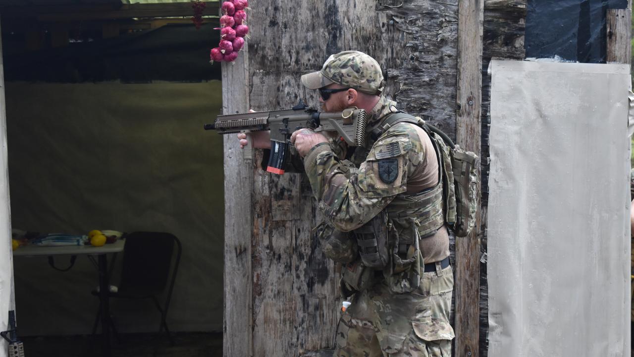 OPERATION TEMPEST: A PLAM player prepares to enter a market venue during Operation Tempest on the Fraser Coast. Photo: Stuart Fast