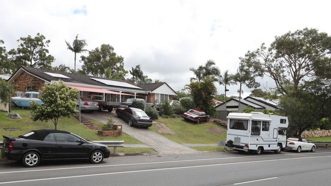 This Cottesloe Drive property at Robina has nine vehicles in its front yard. Picture Glenn Hampson